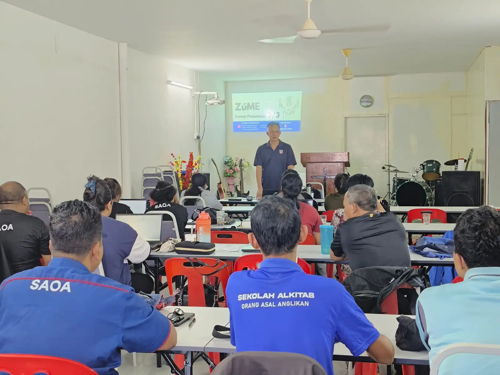 Bible school students listening as Pastor Jony teaches Zúme Training