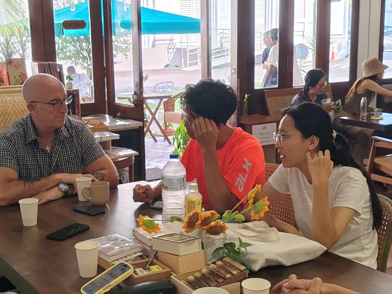 Guests in conversation at the Heritage Café