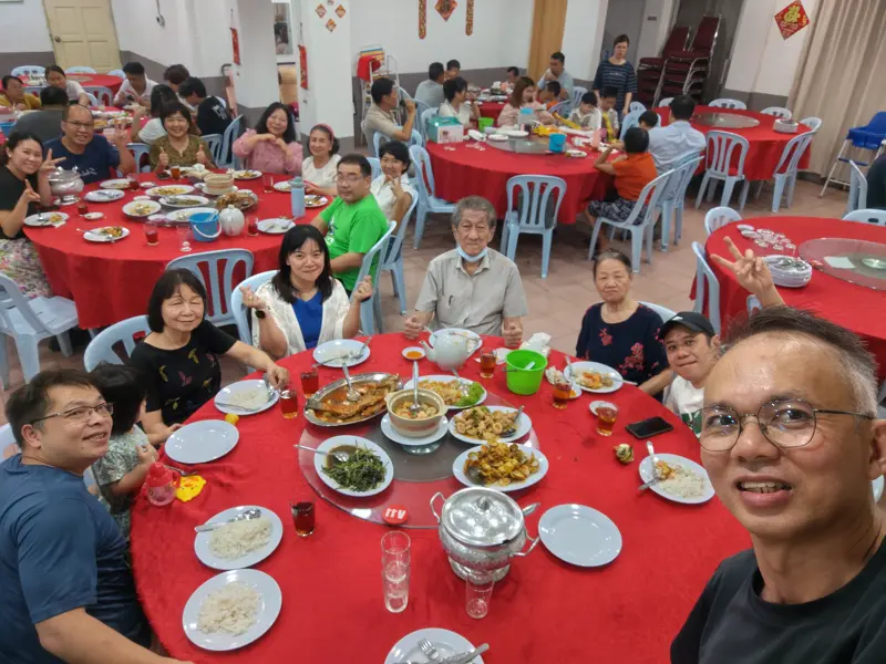 A church fellowship dinner around round tables