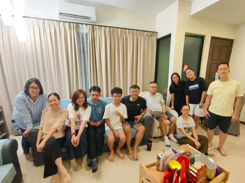 A house group gathered on sofas