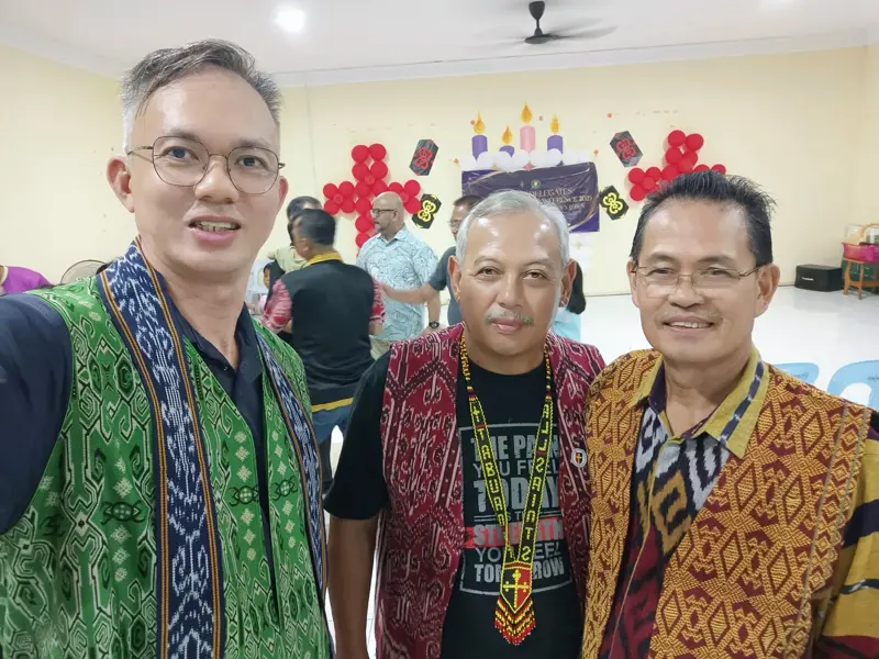 Pastor Jony with two church leaders in traditional East Malaysian dress